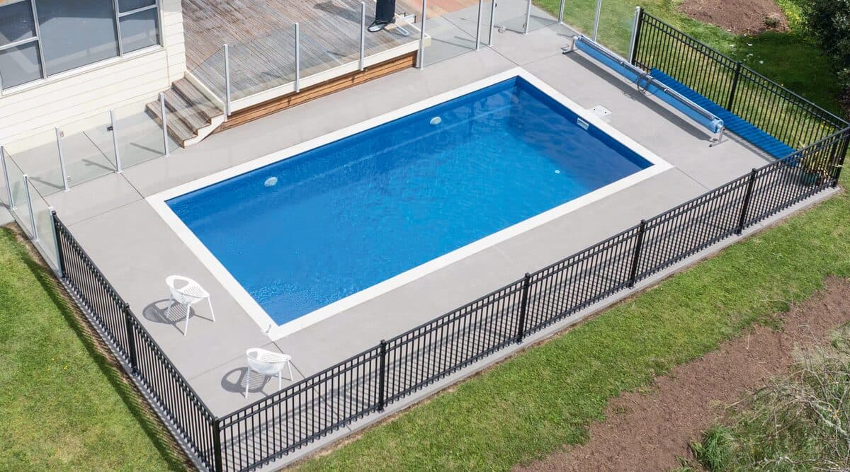 Aerial view of a Kiwi Dream Big 8 pool with black pool fencing