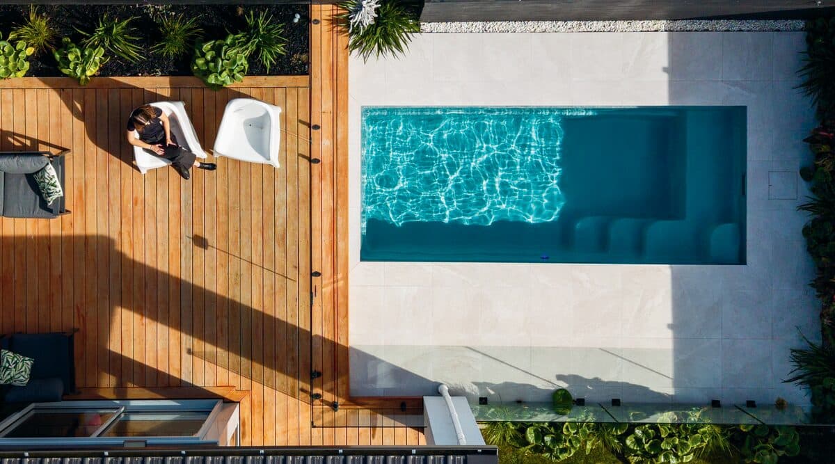 Aerial view of a Kiwi Urban 5 plunge pool beside a timber deck