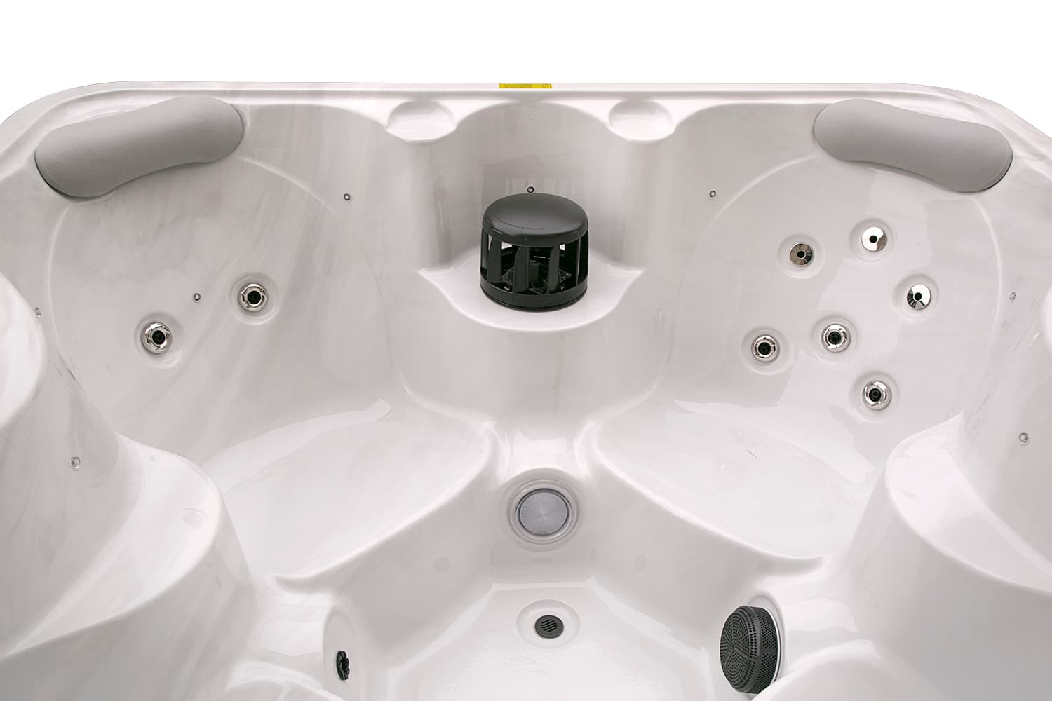 Inside the Akaroa spa: white seats with jets around a central filter